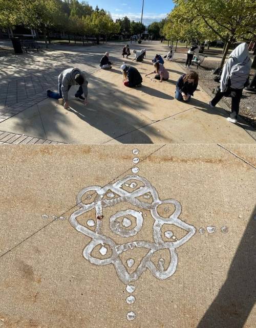 Two photos combined, top photo shows the students creating their designs on the sidewalk on a sunny campus day, bottom photo shows a pulli kolam design close up